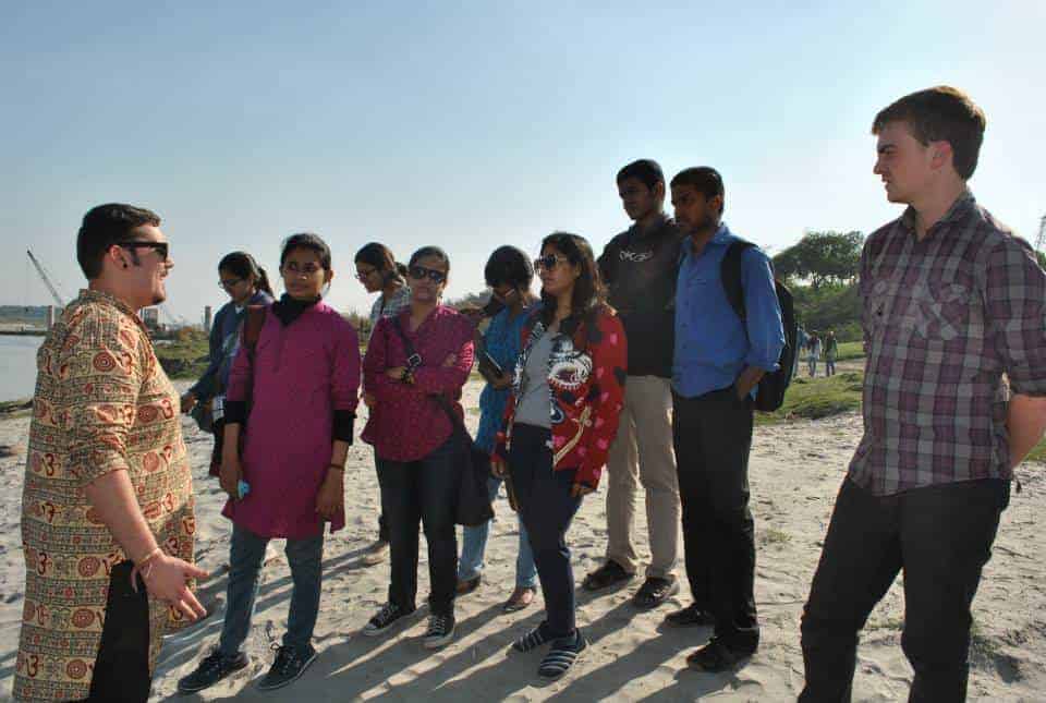 Jack (left) and Josh (right) talking to students from North Campus about the river at  Najafgarh Drain, the first drain that enters the Delhi stretch of Yamuna.