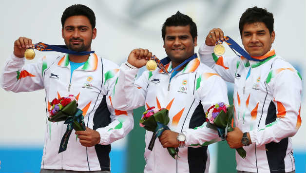 Abhishek Verma with his teammates Rajat Chauhan and Sandeep Kumar after winning a maiden gold in the men's compound team event for Archery at Asian Games 2014.