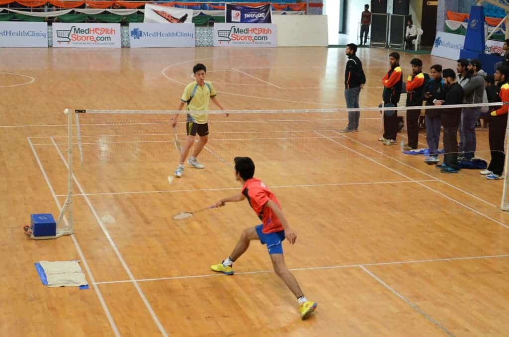 Badminton match in progress at Festival of Youth Sport'15