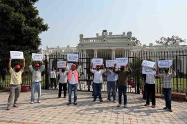 NSUI students holding banners, protesting outside VC lawn