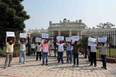 NSUI students holding banners, protesting outside VC lawn