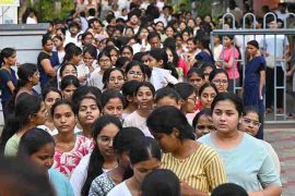 NEET UG re-examination candidates outside an examination centre.