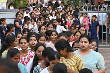 NEET UG re-examination candidates outside an examination centre.