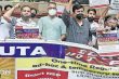 DUTA members protest against NEP 2020 and FYUP making a human chain at Mandi House in New Delhi.