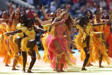 Shakira performs during the first-ever FIFA World Cup halftime show at the 2026 World Cup final, dancing with performers in colourful costumes.