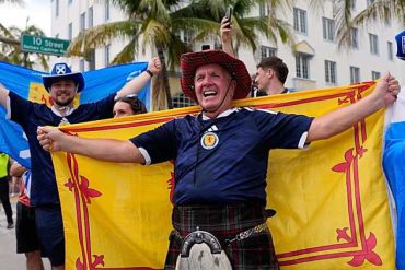 Scotland's Tartan Army supporters celebrate with Scottish flags during the 2026 FIFA World Cup