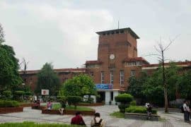 University of Delhi’s Faculty of Arts building, with students in the landscaped courtyard.