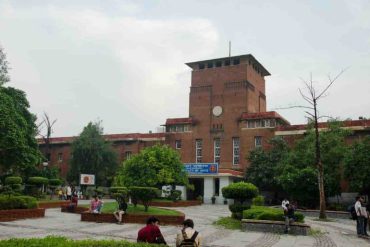 University of Delhi’s Faculty of Arts building, with students in the landscaped courtyard.