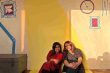Sneha and Navya Misran at the library in Tughlakabad Village, against a wall painted by Kitaab Club and the children.